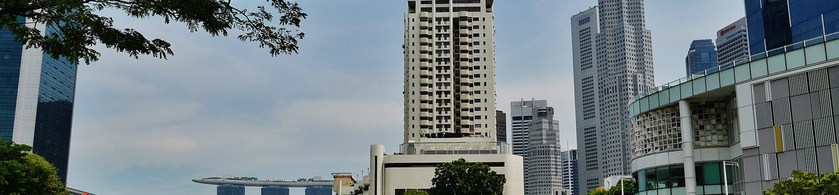 Singapore CBD skyline over the river, viewed from Clarke Quay near Promenade Peak